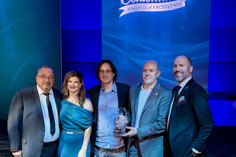 AppCard representatives accepting the IGA 2026 Red Oval Service Provider of the Year award
