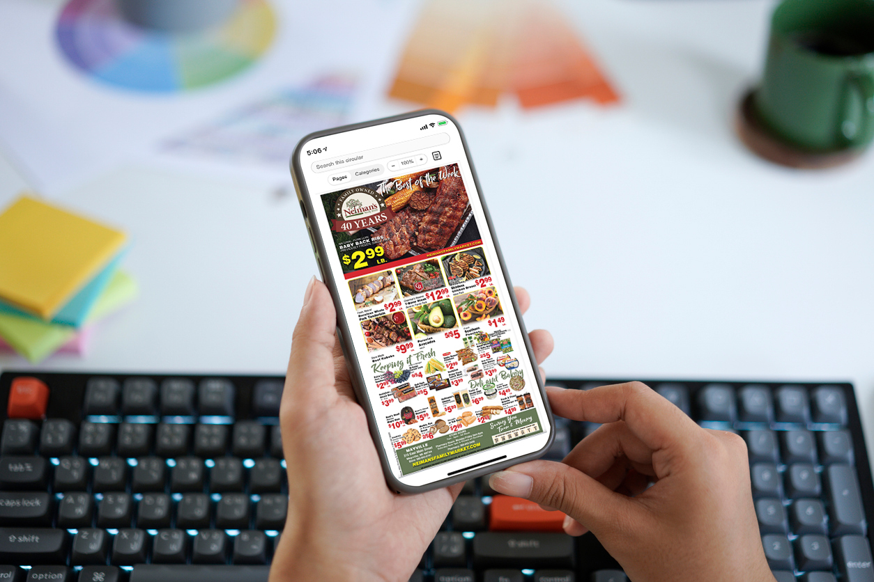 Shopper viewing a grocer's digital circular on a smartphone